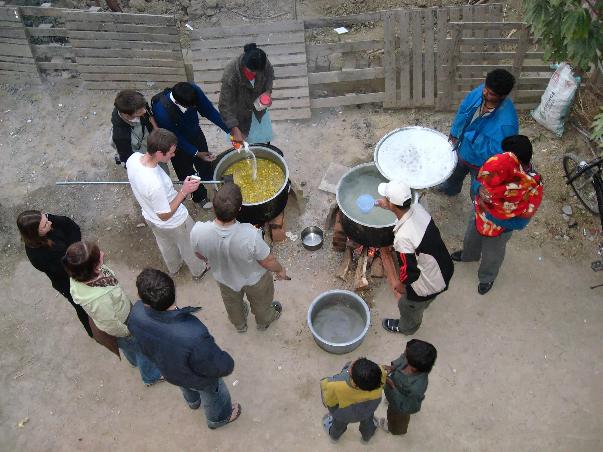 Mission team cooking with a local community